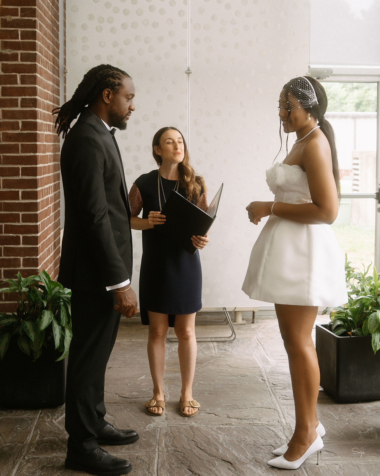 Bride and groom exchanging vows at York Civic Centre minimalist wedding