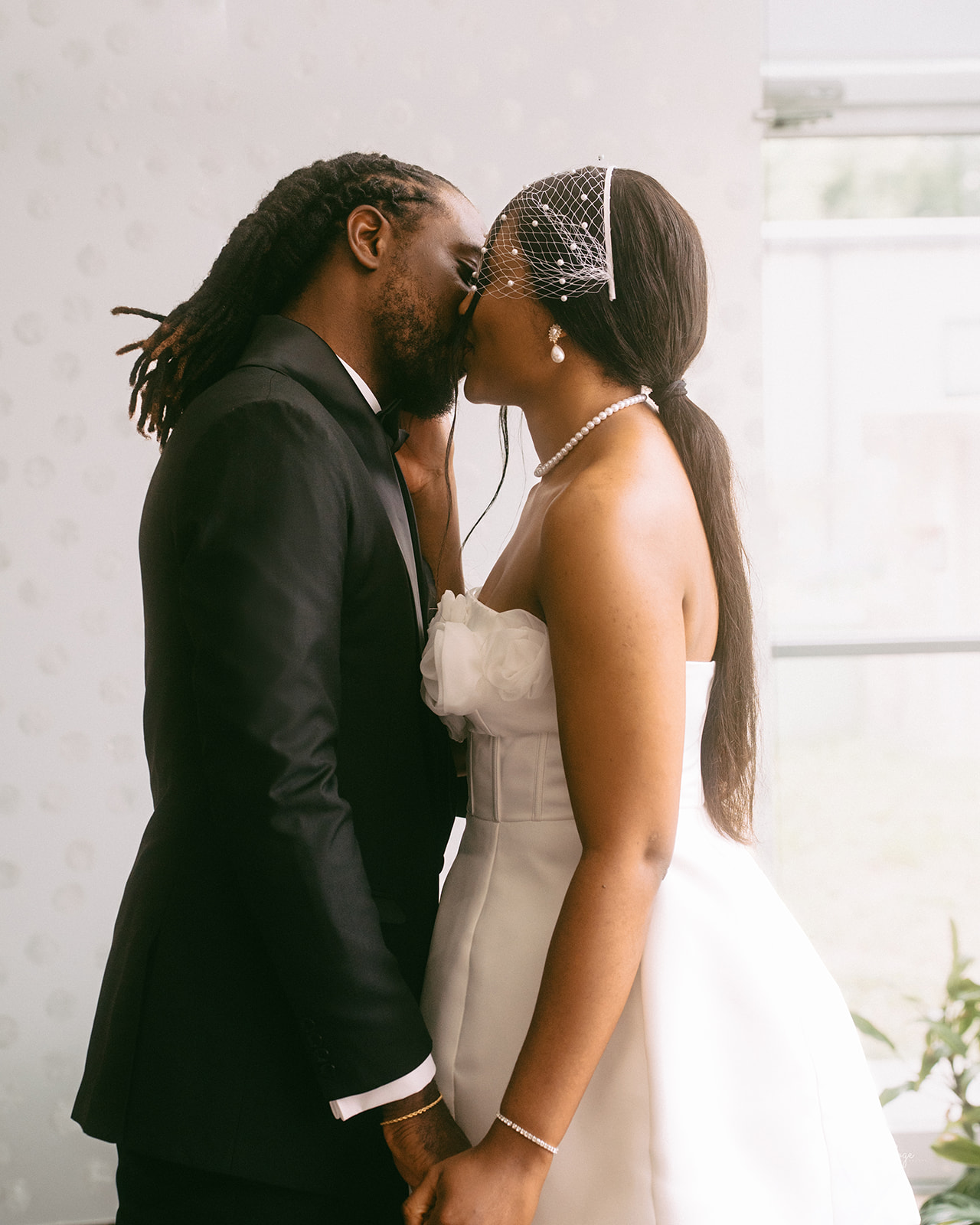 Bride and groom kissing at York Civic Centre minimalist wedding